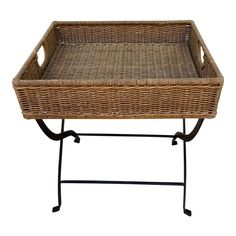 a wicker tray on a metal stand