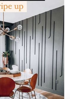 a dining room table with chairs and a chandelier hanging from it's ceiling