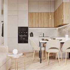 a living room and dining area with wood flooring, white walls and beige furniture