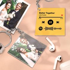 a couple's wedding photos and headphones are on the table next to an mp3 player