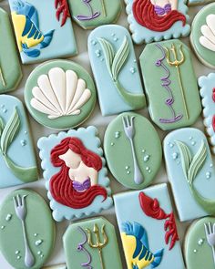 some cookies decorated like mermaids and sea creatures