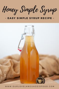 a bottle of honey simple syrup sitting on top of a table