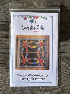 a card with an image of a quilted ring pattern on it's front