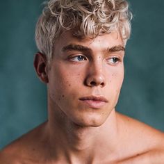 a shirtless young man posing for a photo