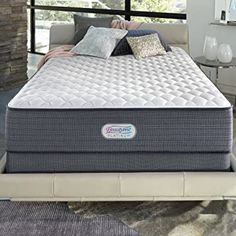 an image of a mattress that is in the middle of a bed with pillows on it