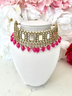 Elevate your elegance with this stunning Hot Pink Indian Jewelry Set, meticulously crafted to add a touch of royalty to your ensemble. This exquisite set is perfect for weddings, festivals, or any special occasion where you want to shine. Features: - Elegant Design: The set includes an adjustable choker necklace, a pair of matching earrings, and a beautiful maang tikka, all adorned with intricate mirror work that reflects light, adding a radiant charm to your look. - Hot Pink and Pearl Beads: Th Pink Indian Jewelry, Jewellery Set For Wedding, Indian Jewellery Set, Intricate Mirror, Indian Jewelry Set, Look Rose, Maang Tikka, Indian Jewelry Sets, Jewellery Set