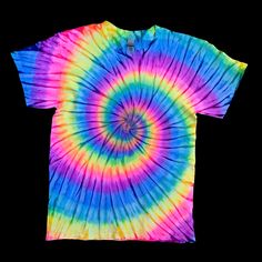 a colorful tie - dyed t - shirt on a black background