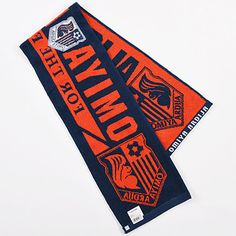 two orange and blue scarfs with the words motivno on them are laying next to each other