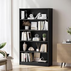 a black bookcase filled with lots of books