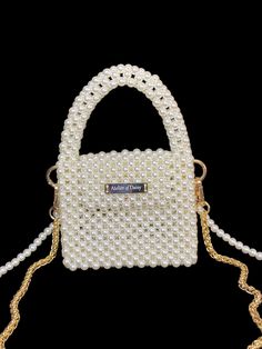 Explore our exquisite collection of handmade bags, featuring unique designs perfect for any occasion. Elevate your style with our elegant Women's Bag, ideal for weddings and special events. Our White Pearl Handbag is a luxurious accessory that adds a touch of sophistication to your ensemble. Whether you're a bride looking for the perfect bag or searching for a Valentine's Day gift, our range of trendy and carefully crafted bags ensures you stand out at any evening party. Embrace the allure of ou Luxury Portable Bags For Gifts, Luxury Portable Bags Perfect For Gifts, Luxury Portable Bag As A Gift, Pearl Handle Tote Bag For Gift, Gift Tote Bag With Pearl Handle, Trendy Handheld Evening Bag As Gift, Trendy Square Evening Bag For Gift, Trendy Shoulder Bag With Pearl Handle As Gift, Trendy Square Evening Bag As Gift