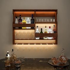 an illuminated bar with bottles and glasses on it