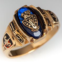 This vintage class ring features an oval blue stone accent with a bulldog head at its center. The ring is from 1977 and is crafted of 10k yellow gold. We love the natural patina left on the gold. Luxury Vintage Commemoration Rings, Vintage Gold Sapphire Ring With Polished Finish, Class Rings High School Vintage, Vintage Gold Hallmarked Enamel Ring, 1990 Class Ring, Antique Blue Hallmarked Signet Ring, Old Boxes, Amethyst Jewelry, February Birth Stone