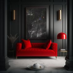 a red couch sitting in front of a painting on the wall next to a lamp