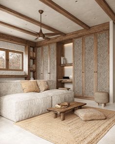 a living room filled with furniture and a large rug on top of a wooden floor