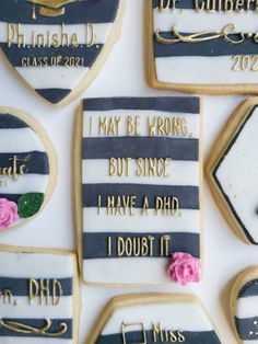 decorated cookies with words and pictures on them are arranged in the shape of heart shapes