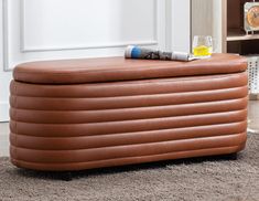 an inflatable ottoman sitting on top of a carpeted floor next to a book shelf