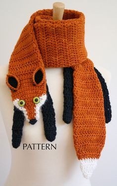 an orange scarf with a black and white fox on it