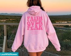 Looking for a christian bible verse hoodie ? Our faith over fear hoodie is the perfect gift for all! It's made of a soft comfortable blend of high-quality materials and is sure to last for years to come. It's perfect for wearing on a cold day, out for a hike, or just lounging around the house. ★Shipping This is a made to order item Our turn around time is 1 to 3 business days. If you need any item by a certain date, please message us and we'll see what we can do! ★Size This sweatshirt is unisex Bible Verse Aesthetic, Verse Aesthetic, Christian Sweatshirts, Aesthetic Christian, Jesus Sweatshirts, Hoodie Aesthetic, Faith Over Fear