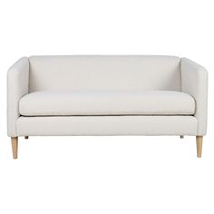 a white couch sitting on top of a wooden frame