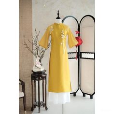 👉 7 DAY REFUND SUPPORT FOR CUSTOMERS IN VIETNAM * Still a Vietnamese girl walking down the street, how beautiful are her innovative ao dai. Selected from the best materials, the 4-piece modern ao dai will bring her the perfect experience. * With a delicate ao dai design in the flower-embroidered sleeves, a little bit of momentum with a stylized side part, this innovative ao dai can turn any girl into a beautiful lady. , young, lovely. * Ao dai in different colors such as pink and beige helps he Yellow Dress With Gold Embroidery For Festivals, Yellow Dresses With Gold Embroidery For Festivals, Yellow Kurta With Gold Embroidery, Long Yellow Dress For Festivals, Long Yellow Festival Dress, Long Yellow Dresses For Festivals, Spring Ceremonial Fitted Dress, Spring Dresses With Gold Embroidery, Formal Embroidered Ao Dai For Spring