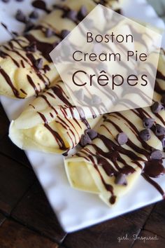 boston cream pie crepes with chocolate drizzled on the top and bottom