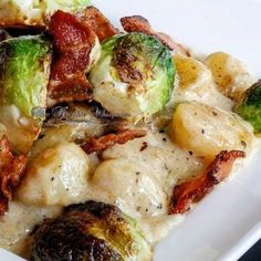 a white plate topped with brussel sprouts and bacon covered in sauce