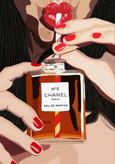 a woman holding a bottle of chanel eau de parfum in her hands