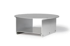 a white table with an open shelf underneath it