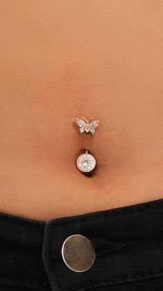 a woman's stomach with a butterfly belly button attached to the back of her body