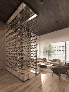 a living room filled with furniture and a wine rack