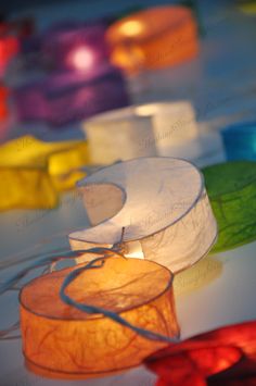 several different colored lights sitting on top of a table