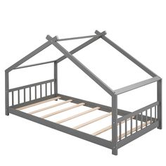 a metal bed frame with a small house on top