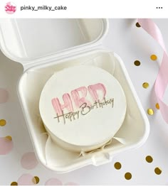 a happy birthday cake in a plastic container