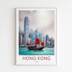 a poster hanging on the wall in front of a white wall with a red and blue boat