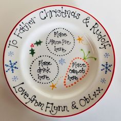 a white plate with red and blue writing on it that says, 10 father christmas & new year