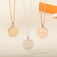 Timelessly sophisticated, our Personalized Disc Necklace is a staple for every jewelry collection. Ideal as a gift for birthdays, christenings, communions and beyond, this hand-engraved necklace perfectly captures unforgettable names, dates, and messages to wear with pride on a shiny, flat disc.18K Champagne Gold Plated, 925 Sterling Silver or 18K Rose Gold PlatedCharm:&nbsp;&nbsp;0.8 x 0.8Secure clasp fasteningCharms are removable from this chain and can be worn on all Merci Maman chain Minimalist Mother's Day Necklace With Engraved Text, Mother's Day Necklace With Engraved Text, Personalized Engraved Metal Charm Necklace, Mother's Day Engraved Name Pendant Necklace, Mother’s Day Necklace With Engraved Text, Liberty Bracelet, Crystal Dice, Grandmother Gifts, Crystal Stars