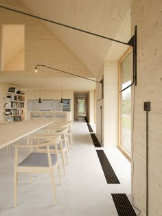 a long table and chairs in a room