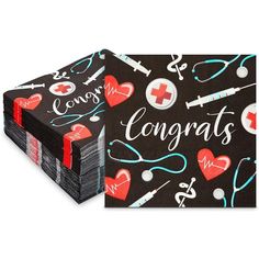 a black napkin with red and blue medical symbols on it that says congrats