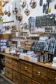 a room filled with lots of different types of pots and pans