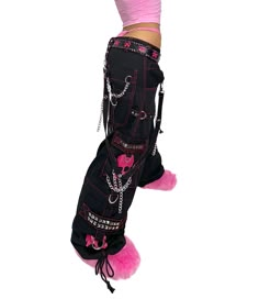 Accept no imitations! From the originator of all things DarkStreet, these black and pink studded pants zip off into shorts (★≧▽^))★☆. They feature two skulls on each leg, removable chains, adjustable ankles, D-rings, and deep pockets. – Drawstring and adjustable waist buckles allow for a tighter fit on the waist. 100% Cotton. Waist measurements are based on the waistband's full extension - that is the maximum inches that the waist will extend to. MODEL IS WEARING X-SMALL SIZE WAIST (Fully Extend Scenemo Clothes, Pink And Black Pants, Scene Shorts, Studded Pants, Scene Clothes, Pretty Hair Cuts, Skull Pants, Punk Diy, Tripp Pants