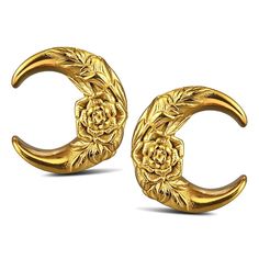 two gold earrings with flowers on them