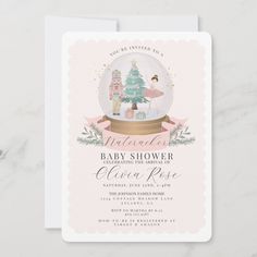 a baby shower with a snow globe and christmas tree