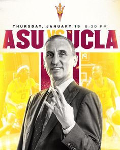 a man in a suit and tie standing next to an advertisement for the asu basketball team