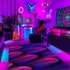 a living room filled with furniture and neon lights on the wall above it's colorful rug