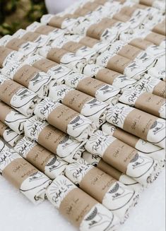 several rolls of toilet paper sitting on top of a table covered in brown and white wrapping