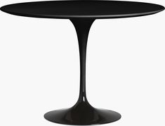 a black table with an oval top on a white background in the shape of a tulip