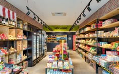 a grocery store filled with lots of food and drink bottles on shelves next to each other