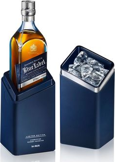 a bottle of blue label with ice cubes in the bottom and an empty container on top