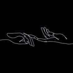 two hands reaching for each other in the dark