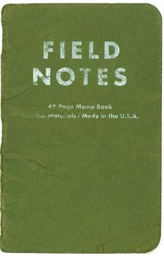 an old book with the words field notes written in white ink on green paper,